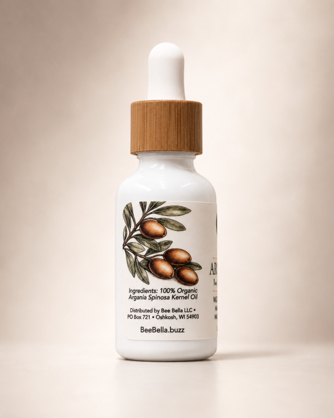 Bee Bella Argan Oil back label showing 100% Organic Argania Spinosa Kernel Oil ingredients with an argan branch illustration