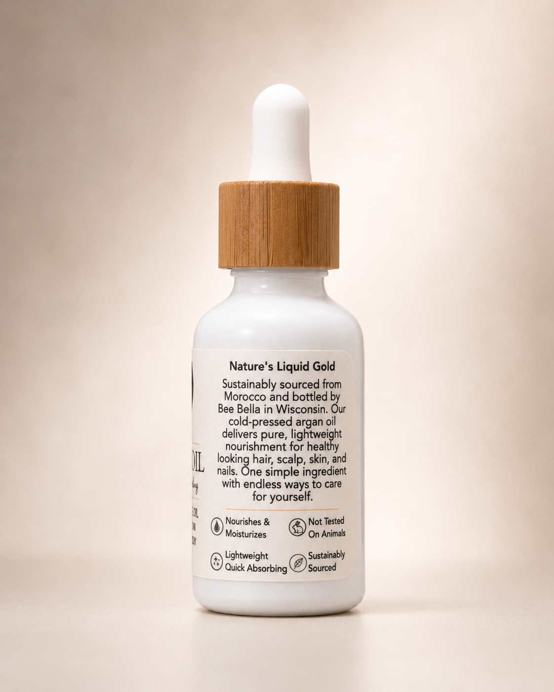 Bee Bella Argan Oil side label with Nature's Liquid Gold description and product benefit icons