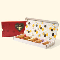 Bee Bella Holiday Variety 5-Pack Lip Balm Gift Box in cream holiday gift packaging
