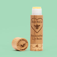Peppermint natural beeswax lip balm on cool mint color background