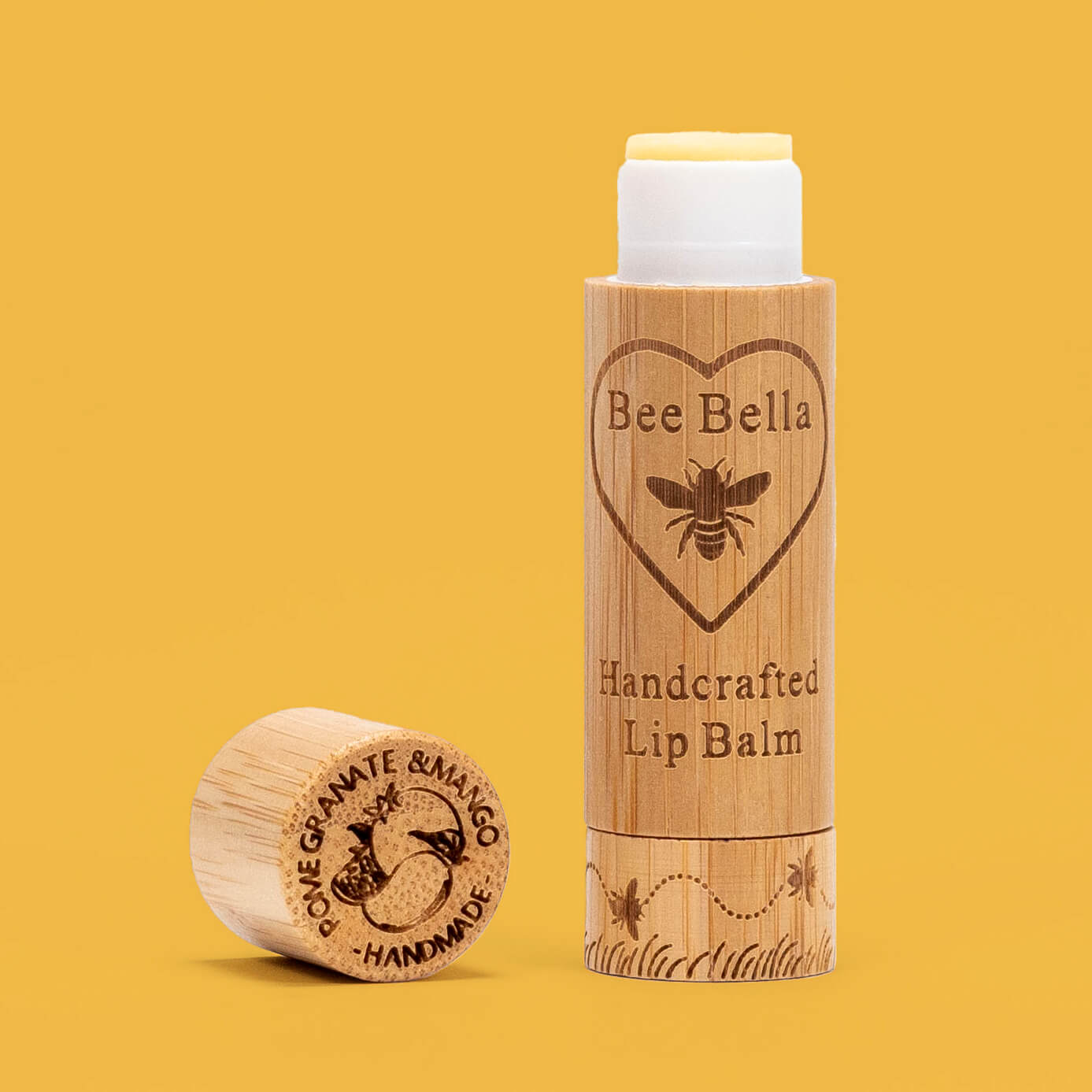 Pomegranate and Mango natural beeswax lip balm on vibrant color background