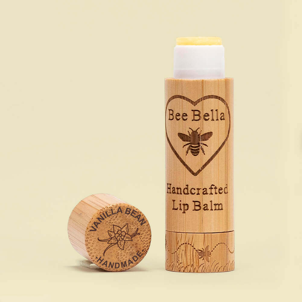 Vanilla Bean natural beeswax lip balm on warm cream color background