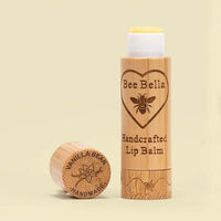 Vanilla Bean natural beeswax lip balm on warm cream color background